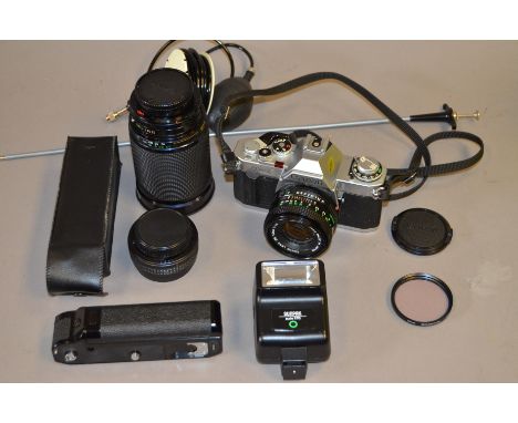 A Canon AV-1 SLR Camera Outfit, with 50mm f/1.8 FD lens, Vivitar 28-200mm f/3.5-5.3 zoom, Canon power winder, Sunpak flash un