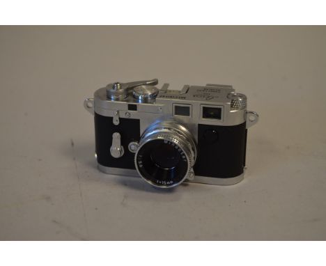 A Minox Leica M3 Film Camera, serial No-M3-E00147, shutter working, body VG, elements G  