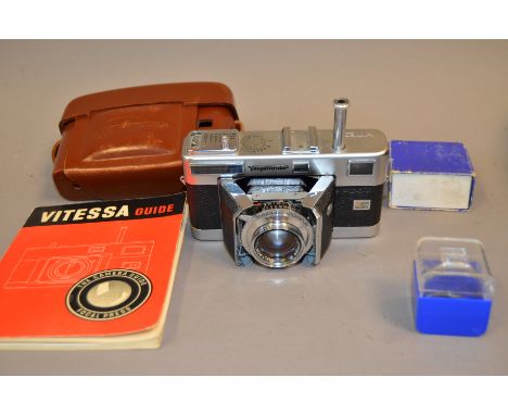 A Vöigtlander Vitessa Rangefinder camera, with Ultron 50mm f/2 lens, shutter firing intermittently, light meter responsive, b