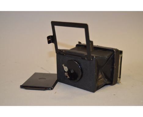 An Erneman Liliput Folding Camera, circa 1920, bellows VG, body, body G, repainted on front, with film slide  