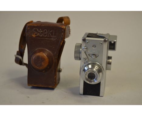 A Steku 16mm Camera, shutter working, body VG, elements VG, in leather case 