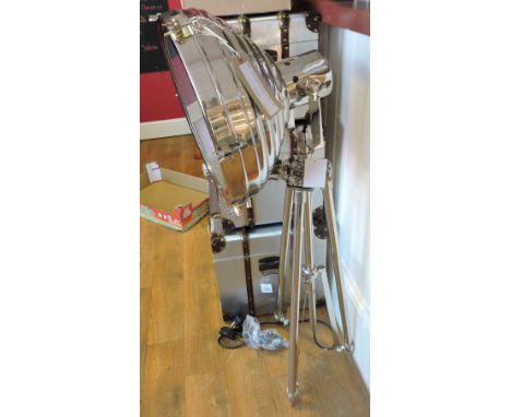 A chrome-plated studio lamp, with large circular shade on tripod base, D. 42cm.