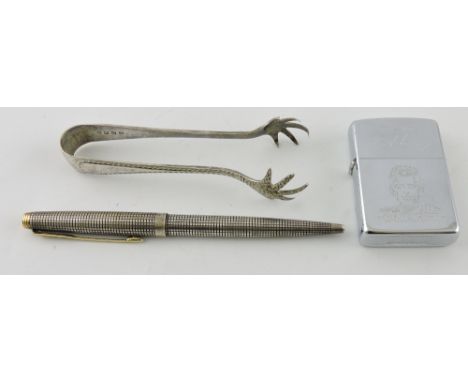 A Parker sterling silver cross ballpoint pen, a Kennedy commemorative zippo lighter and a pair of plated tongs.