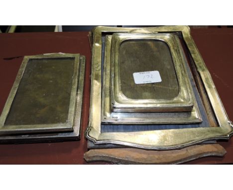 A rectangular silver photo frame, Birmingham 1928, with engine-turned border, together with four other silver mounted photo f