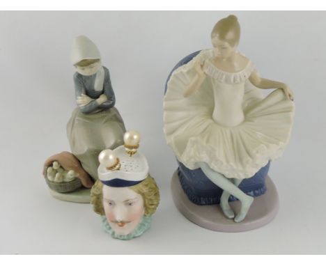 A late 19th century Janus-type hat pin holder modelled in the form of male and female heads, H. 9cm; together with a Lladro f