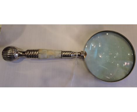 A table magnifier with mother-of-pearl and turned plated handle, lens D. 10cm.