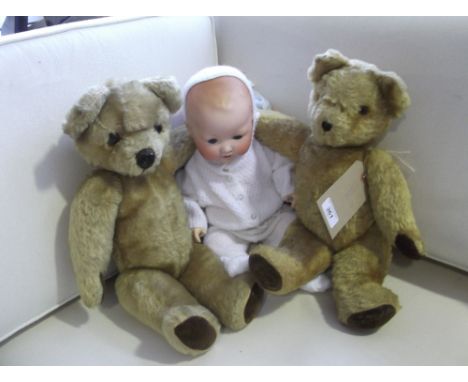 A post first war Armand Marseille doll, with open mouth and moulded hair, L. 47cm, together with two 1950's teddy bears, (3)