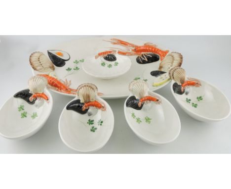 A large 20th century Italian ceramic seafood platter, modelled with langoustine, mussels and scallop shells; together with fo