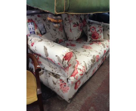 A HSL FLORAL PRINT DROP END SETTEE