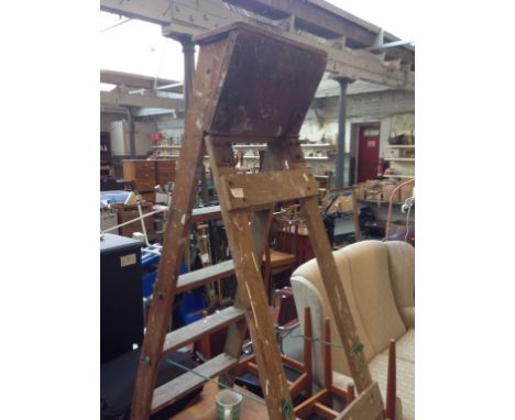 A SET OF VINTAGE WOODEN STEP LADDERS