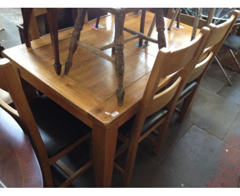 LIGHT OAK EXTENDING TABLE AND SIX CHAIRSCONDITION: CENTRE LEAVES PRESENT. SOME SCUFFS TO CHAIR LEGS AND TOPS.