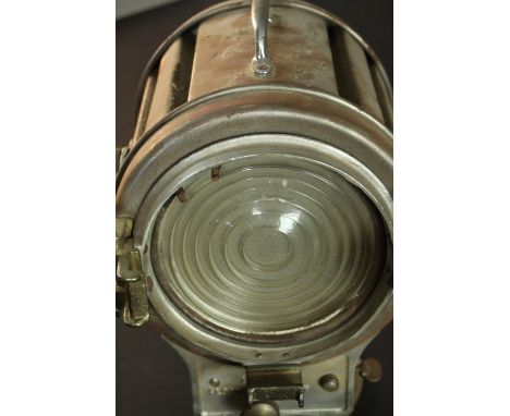A vintage Mole-Richardson theatre spotlight and hinged wall bracket. Relief makers mark. H.20 Dia.22cm. 