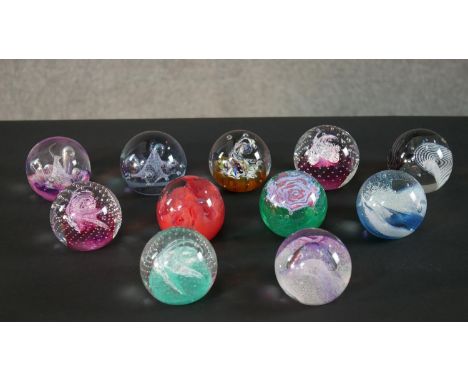 A collection of eleven limited edition Caithness lamp work glass paperweights. Stamped to the base. H.6 W.8cm (largest) 