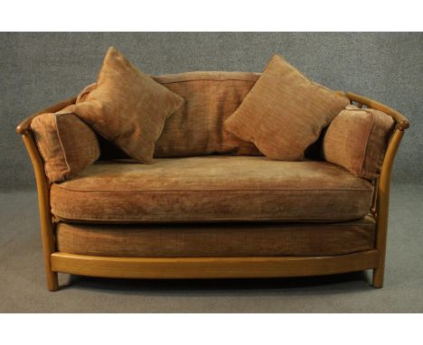 A vintage light elm Ercol Renaissance sofa with maker's label. 