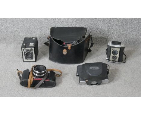 A collection of vintage cameras. Including a Yashika, Praktika super TFL and two vintage brownie cameras.   H.16 W.20 D.16cm 