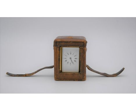 A fitted leather cased 19th century gilded brass French carriage clock, with bevelled plates and white enamel dial with Roman