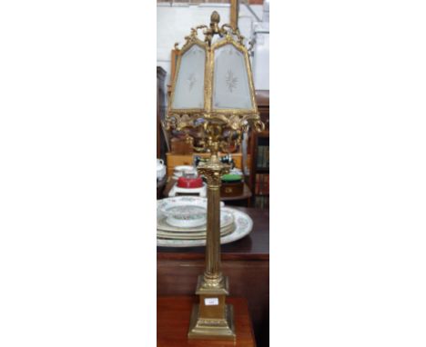A BRASS TABLE LAMP in the form of a Corinthian column with later shade