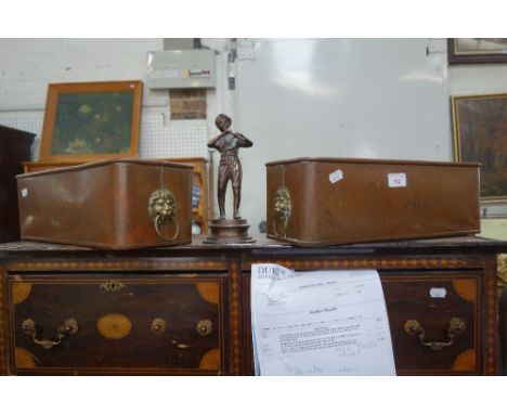 A PAIR OF COPPER PLANTERS with lion mask handles and a cast metal figure of a boy playing his flute