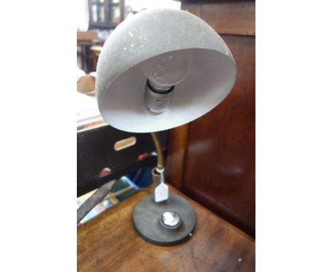 A FRENCH ADJUSTABLE DESK LAMP with iron base and chrome switch