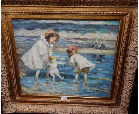 AN IMPRESSIONIST STYLE OIL ON CANVAS PAINTING of children playing in the sea, initialled "JWB" in gilt frame