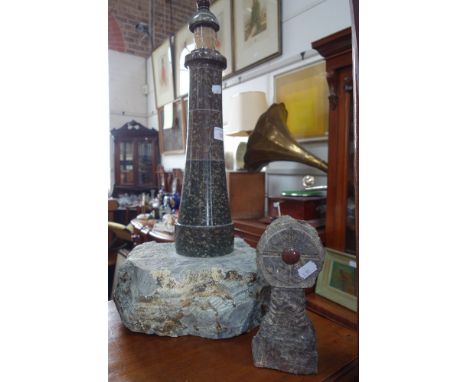 A LARGE TURNED SERPENTINE LIGHTHOUSE LAMP and a similar table cross