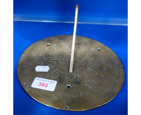 A BRASS SUNDIAL, engraved, 'Tempus Labile 1709', 20cm dia.