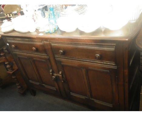 A STAINED ERCOL SIDEBOARD, 122cm wide