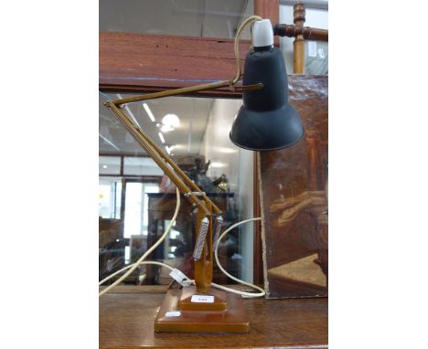 A HERBERT TERRY ANGLEPOISE LAMP in brown with a black shade