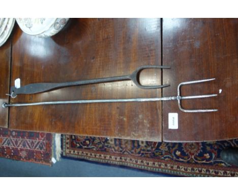 A REGENCY POLISHED STEEL TOASTING FORK and an iron toasting fork