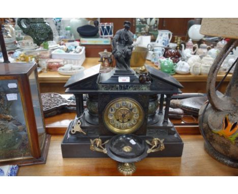 A LARGE VICTORIAN SLATE MANTEL CLOCK of architectural form, surmounted by a spelter figure and a similar slate and brass tazz