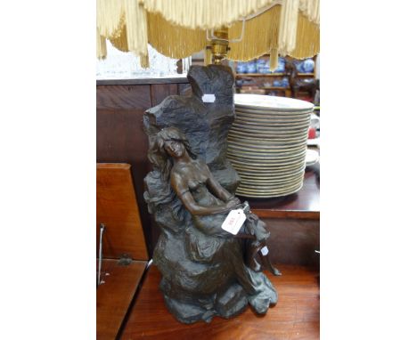 A BRONZED BELLE EPOQUE STYLE LAMP in the form of a maiden sitting on rocks holding a lily