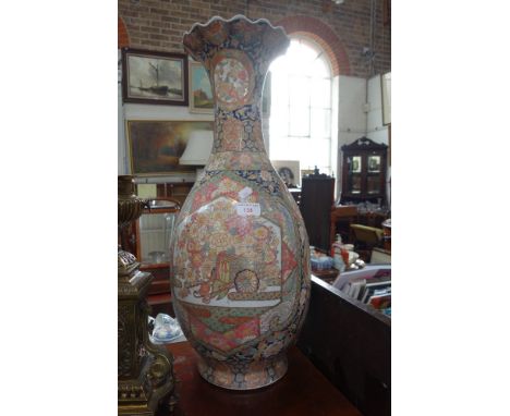 A LARGE PAIR OF JAPANESE VASES of baluster form with flaring and waved rims decorated with gilt and enamel