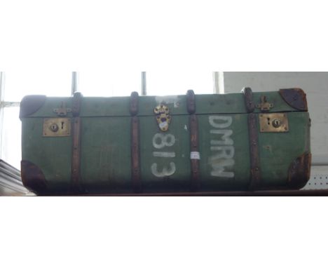 A GREEN CANVAS COVERED AND WOODEN BOUND TRAVELLING TRUNK