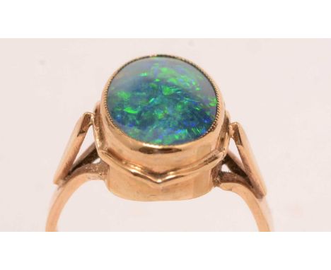 An opal triplet and yellow-metal dress ring, stamped 9ct, 4.3g gross.