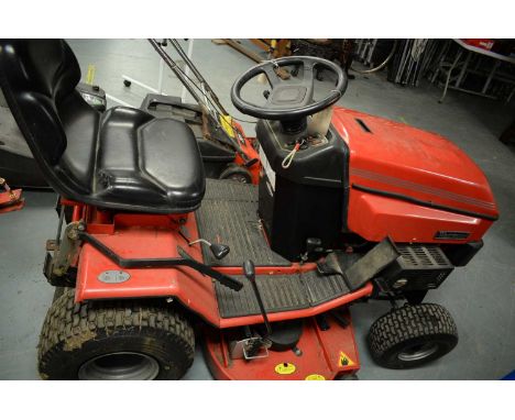A Westwood T1600 ride-on petrol lawn mower, together with trailer, grass box, snow plough and lawn roller.