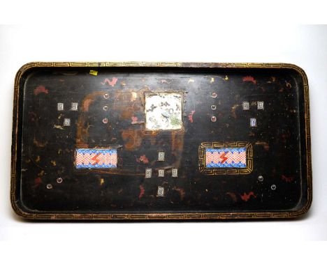 A Japanese lacquered oblong tea tray, the top inset with three painted ceramic tiles, 84cms wide.