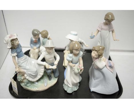 Two Nao figure groups of courting couples, the tallest 23cms high; and four Nao figures of girls. (6) 