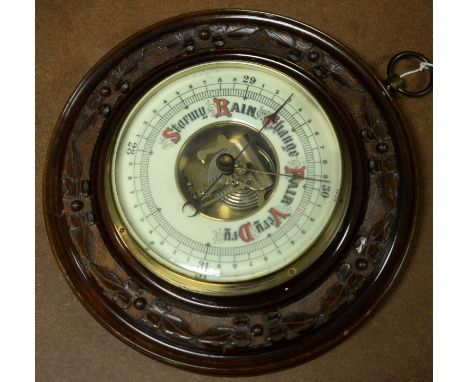 Early 20th Century wall barometer, in carved, stained wood frame.