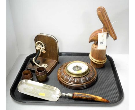 20th Century wall barometer, 18cms diameter; mahogany bookend with anchor motif; carved wood bird figure; two miniature barre