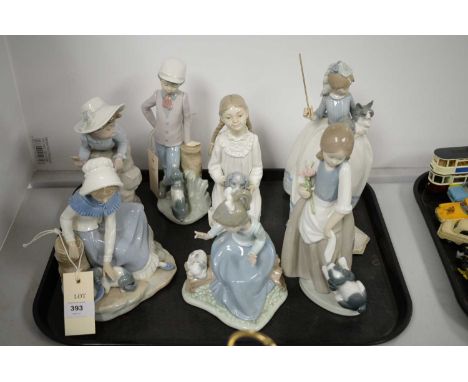 Selection of seven Nao figures of children, comprising six modelled with a puppy, and the other with a cat, the tallest 24cms