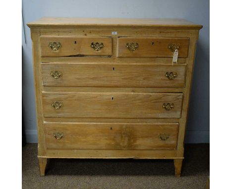 A 19th Century stripped pine chest of drawers, the rectangular top above an arrangement of two short over three long graduate