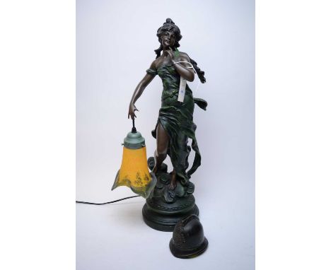 Art Nouveau style spelter figural table lamp, modelled as a lady in a flowing gown, holding a lamp with mottled orange and gr