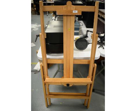 Winsor &amp; Newton beech artists easel; and a selection of artist's sketch books. 