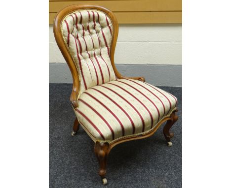 A walnut framed spoon-back chair with striped upholstery, circa 1890