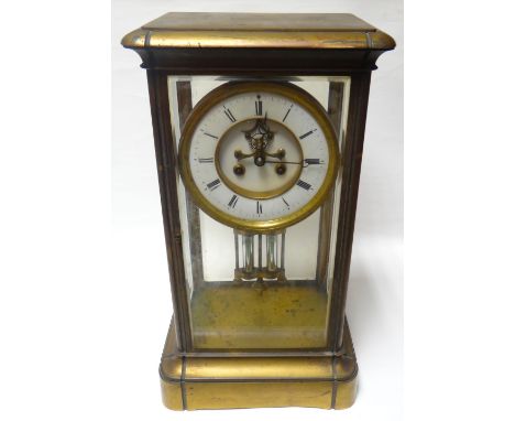 A French regulator clock with mercury pendulum, having a circular white enamel dial bearing Roman numerals and encased with b