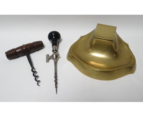 An art nouveau brass inkwell, impressed to the base GESCHUTZT; together with an antique corkscrew with treen handle and a cha