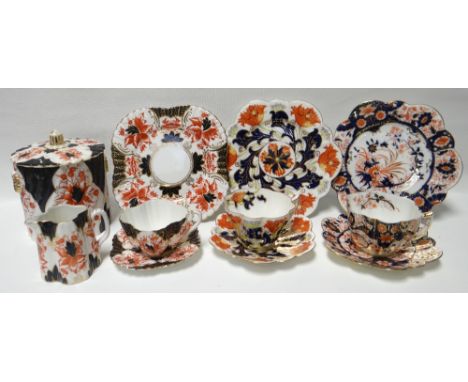 An eleven piece Wileman part-tea service in the Imari palette, together with a pair of similar patterned Wileman trios and a 