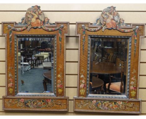 A fine pair of painted satinwood framed beveled wall-mirrors, Italianate decorated with flowers, cherubs and foliage, snaking