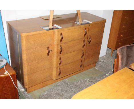 A 1930's light oak Art Deco dining suite comprising dining table (76 cm x 138 cm x 84 cm)  a set of 4 chairs upholstered in b