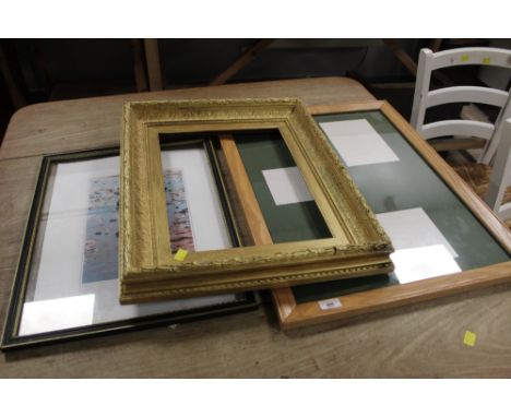 A gilt picture frame, a limited edition print of reflection and a modern oak picture frame with green mount 